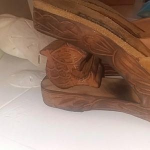 Wooden wedges with dolphin carved in heel